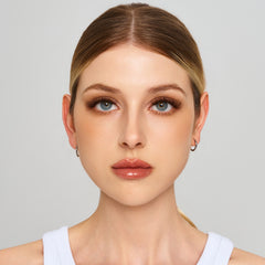 Front-facing beauty portrait showing the Cocoa Noir lash look.